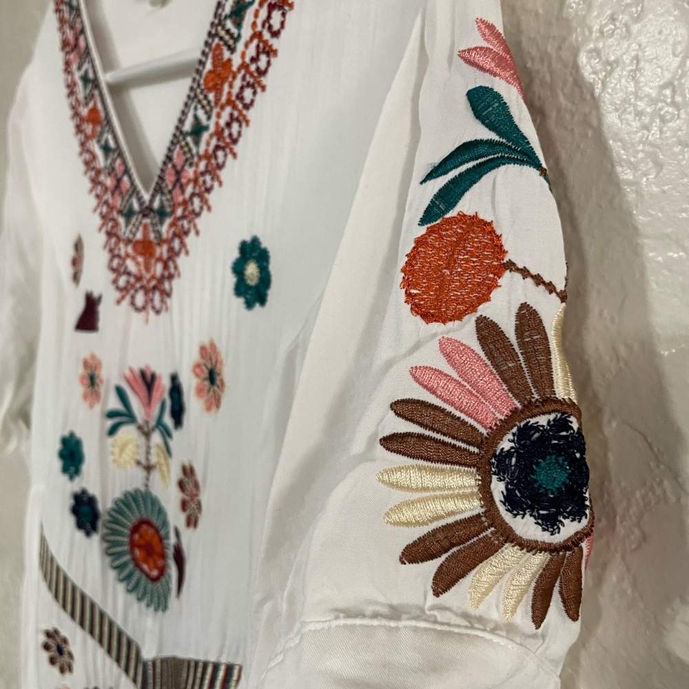 Embroidered white dress.